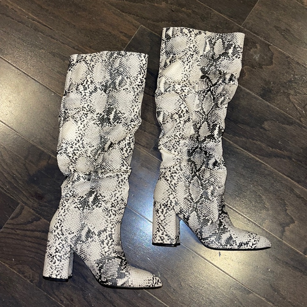 Snake print knee high boots